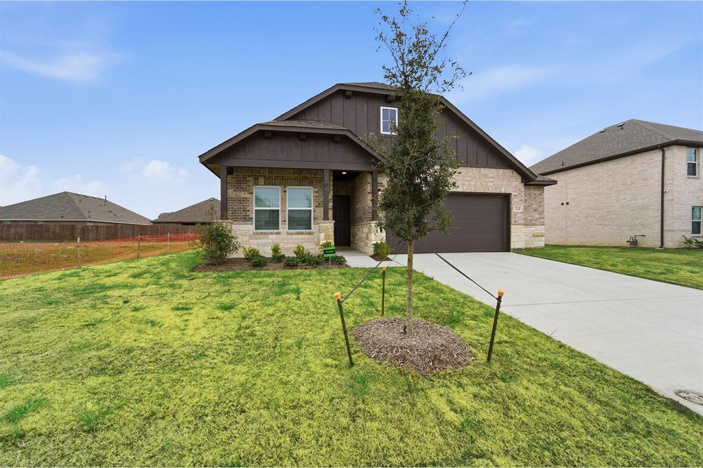 232 Triple Crown Road Waxahachie, TX 75165 - Photo 2 of 22 a front view of a house with garden