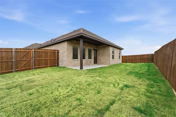 a view of a backyard with a garden