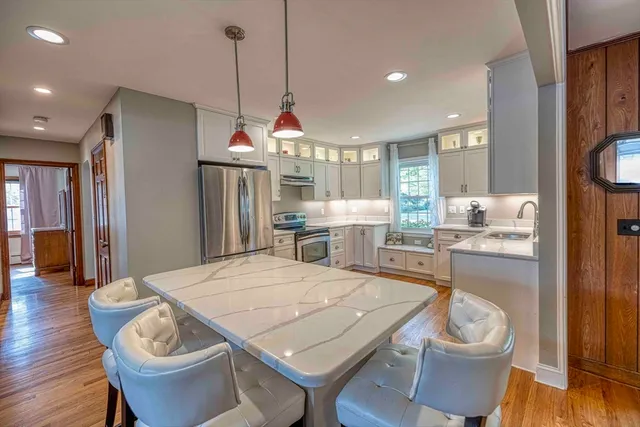 a kitchen with a table and chairs