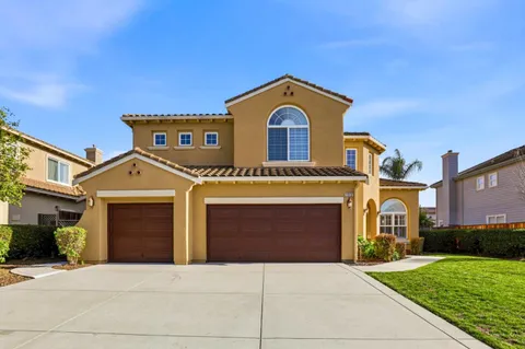 a front view of a house with yard