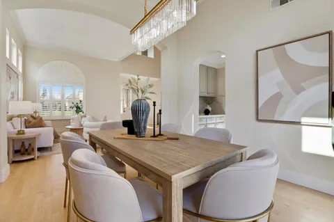 a living room with fireplace furniture and a wooden floor