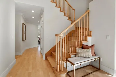 a living room with furniture rug and a window