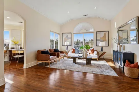 a living room with furniture and a rug