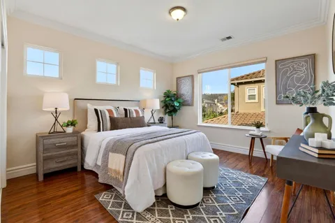 a bedroom with a bed and a table