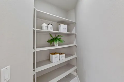 an aerial view of a houses with a city street