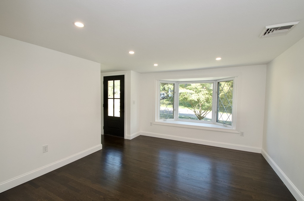 7 Barbara Road Kingston, MA 02364 - Photo 9 of 26 an empty room with wooden floor and windows