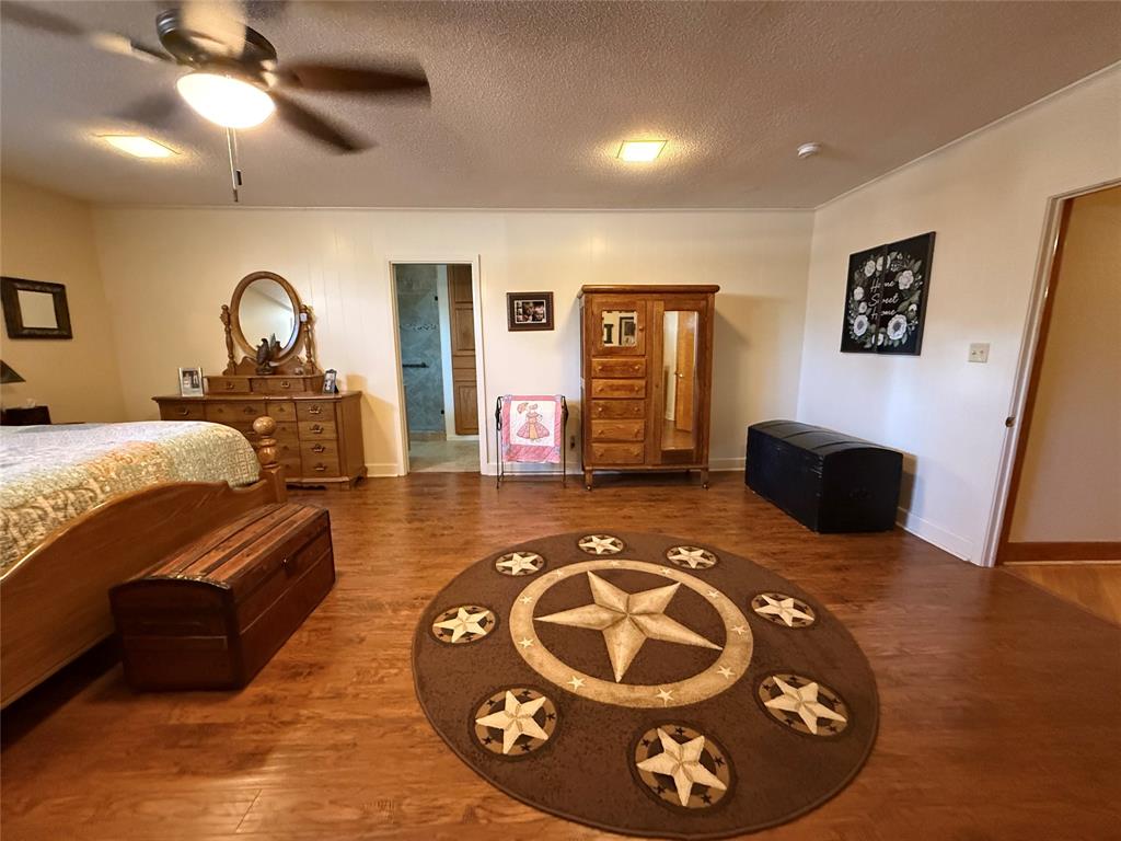 908 North Austin Street Comanche, TX 76442 - Photo 17 of 37 a living room with furniture and a fireplace