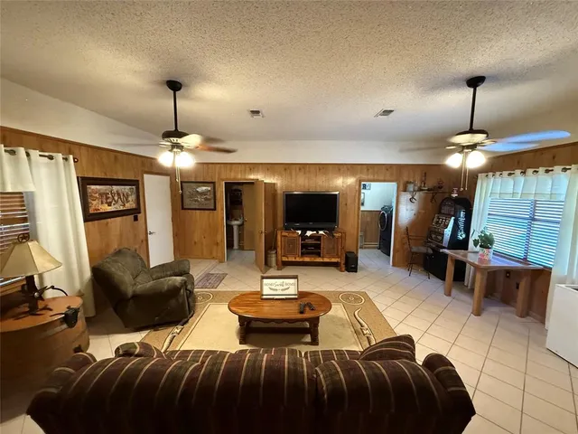 a view of a livingroom with furniture window and outside view