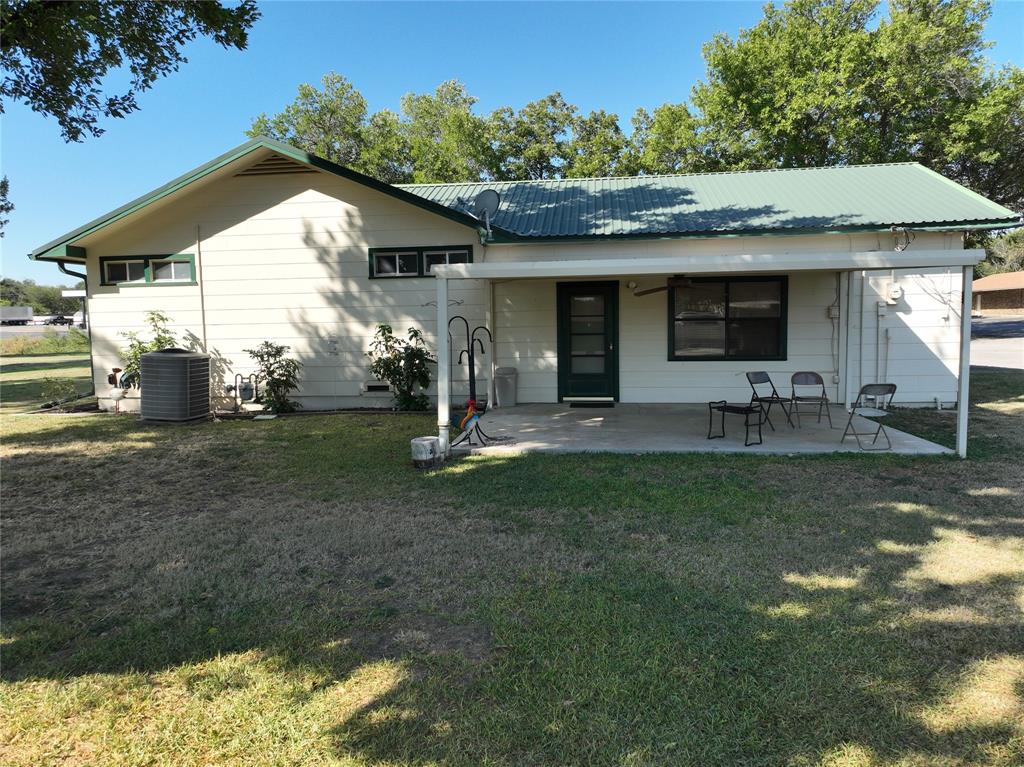 908 North Austin Street Comanche, TX 76442 - Photo 28 of 37 a view of a house with backyard