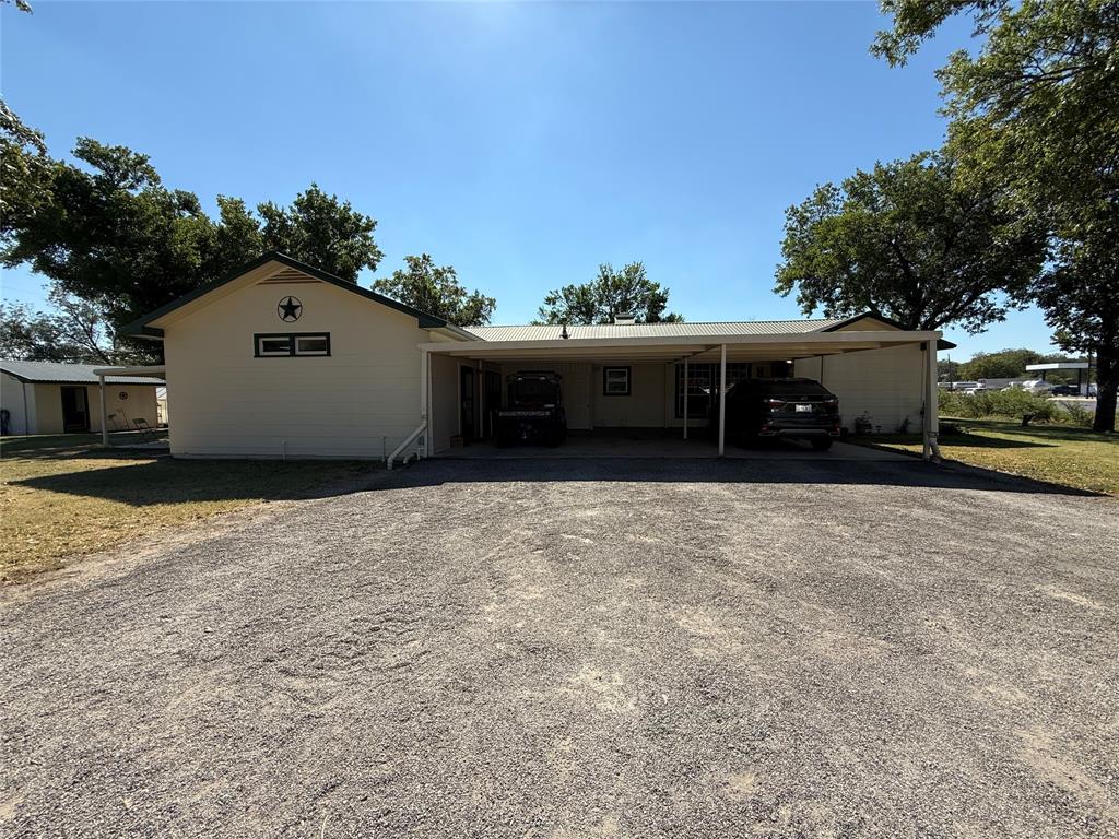 908 North Austin Street Comanche, TX 76442 - Photo 33 of 37 a view of a house with a yard