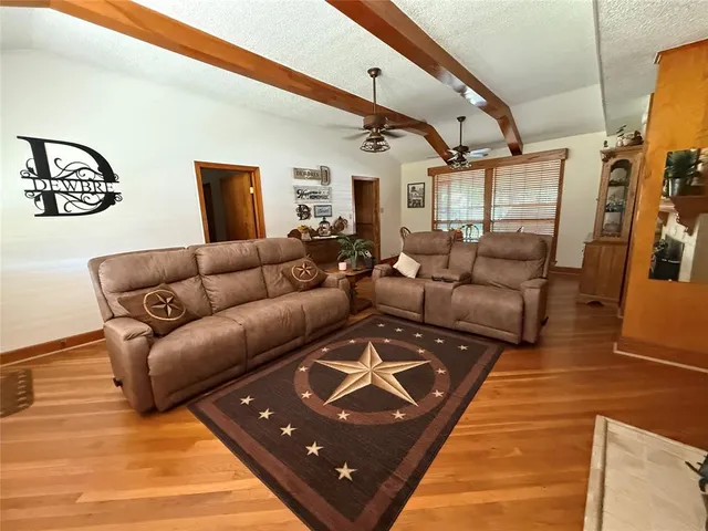 a living room with furniture and a rug