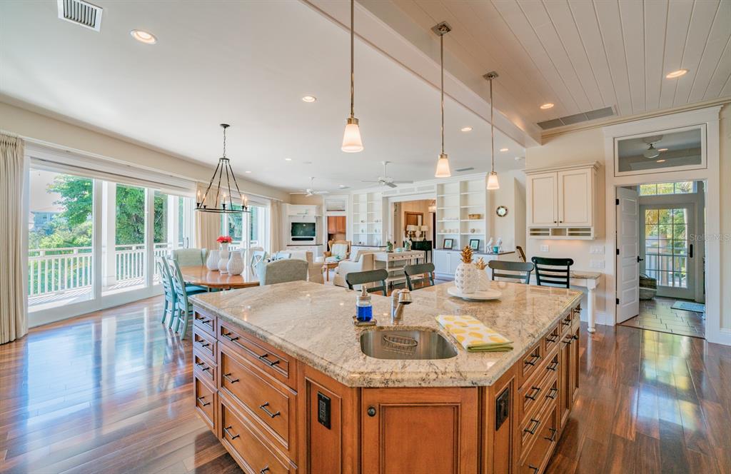 714 Jacaranda Road Anna Maria, FL 34216 - Photo 17 of 100 a kitchen with stainless steel appliances granite countertop a stove and refrigerator