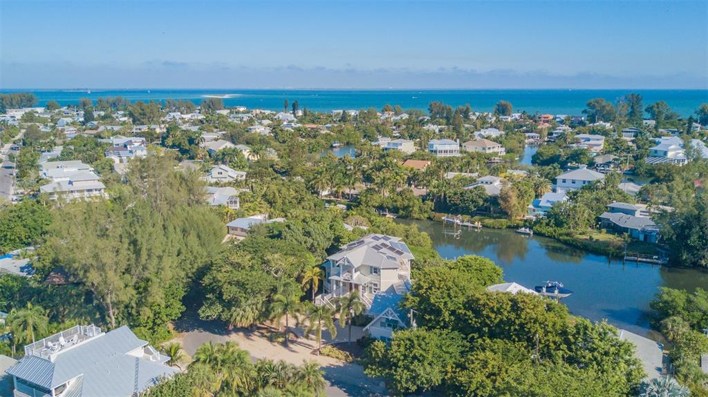 714 Jacaranda Road Anna Maria, FL 34216 - Photo 2 of 100 an aerial view of a city with lots of residential buildings lake and ocean view
