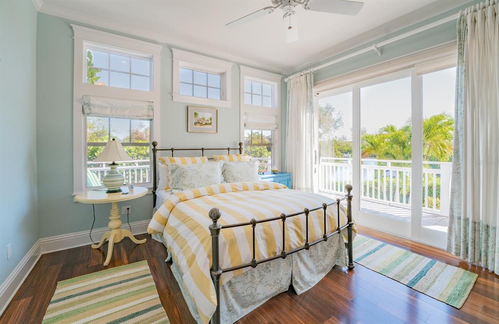 714 Jacaranda Road Anna Maria, FL 34216 - Photo 22 of 100 a bed sitting in a bedroom next to a window