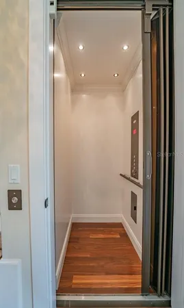 a view of wooden floor and windows in a room