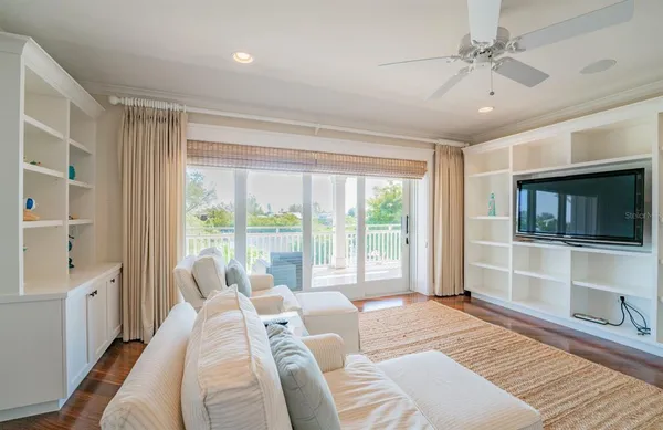 a bed room with a bed and a chandelier