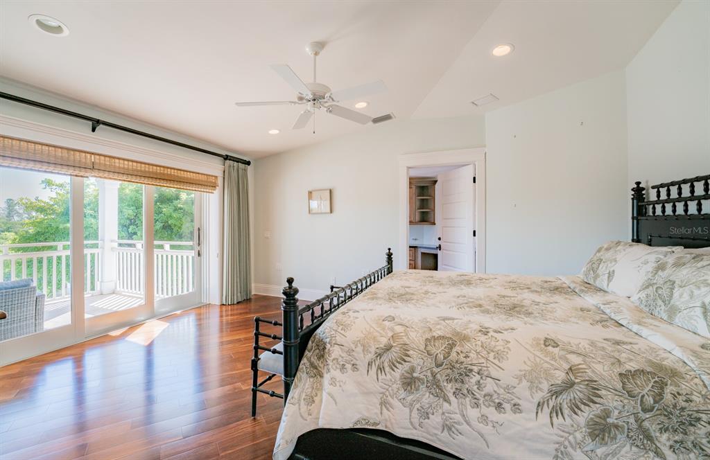 714 Jacaranda Road Anna Maria, FL 34216 - Photo 36 of 100 a bedroom with a large bed and a large window