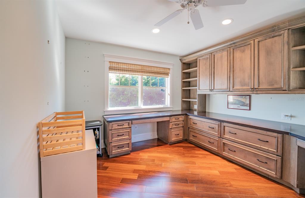 714 Jacaranda Road Anna Maria, FL 34216 - Photo 39 of 100 a kitchen with stainless steel appliances granite countertop a refrigerator and microwave