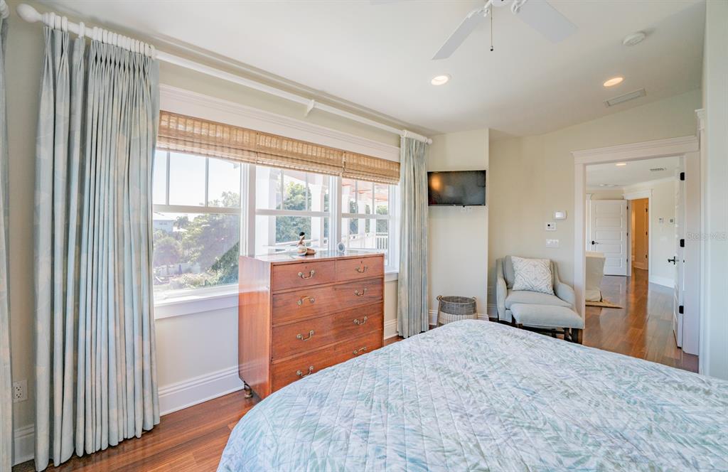 714 Jacaranda Road Anna Maria, FL 34216 - Photo 43 of 100 a bedroom with a bed and wooden floor