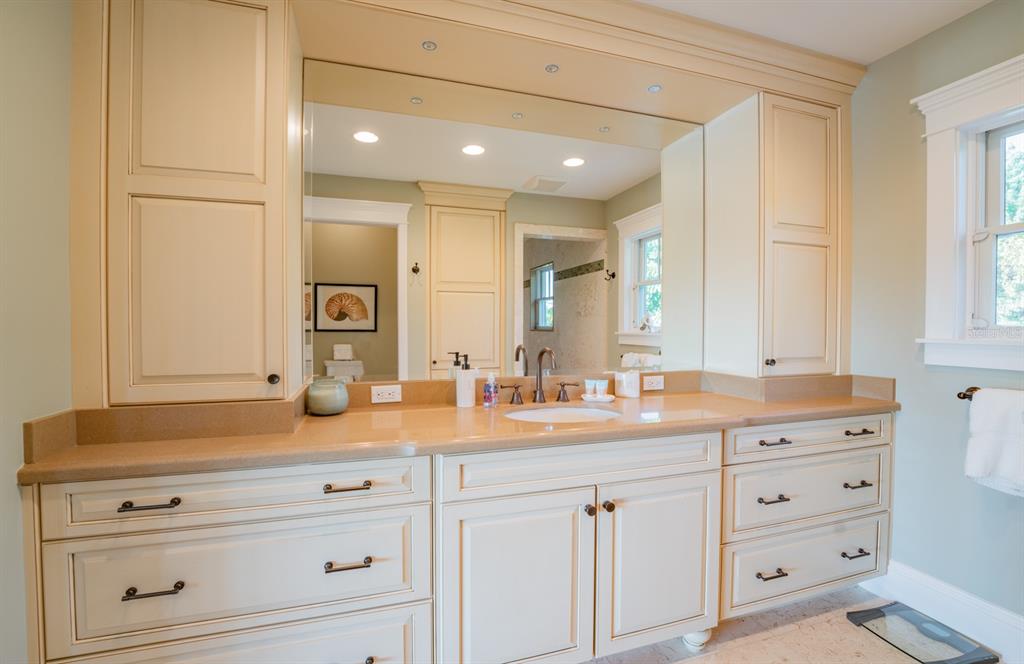 714 Jacaranda Road Anna Maria, FL 34216 - Photo 46 of 100 a bathroom with a sink and a mirror