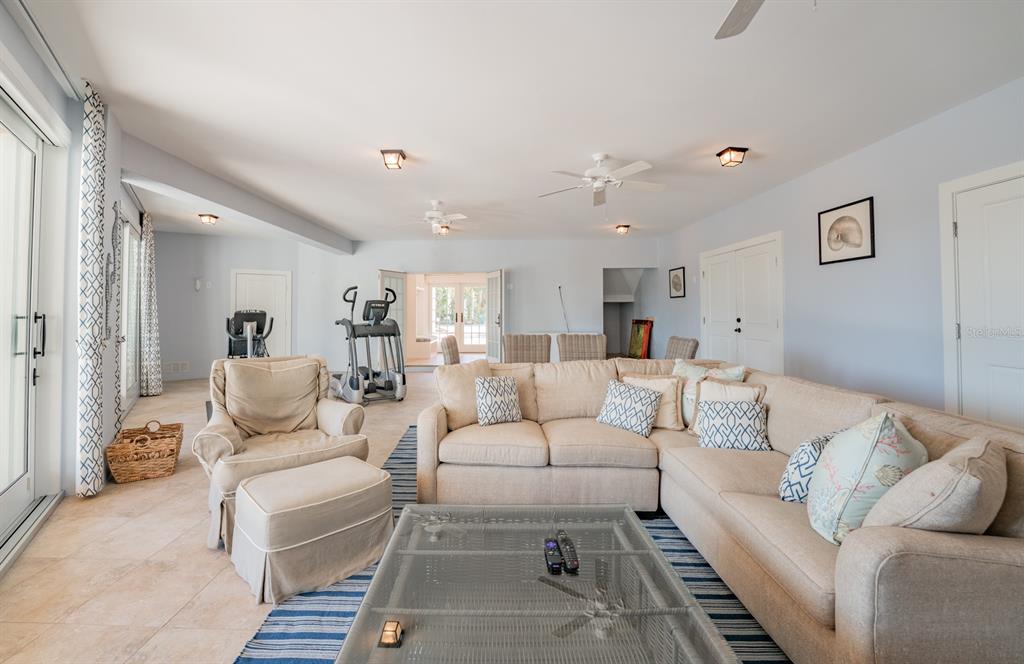 714 Jacaranda Road Anna Maria, FL 34216 - Photo 56 of 100 a living room with furniture or couch and a mirror