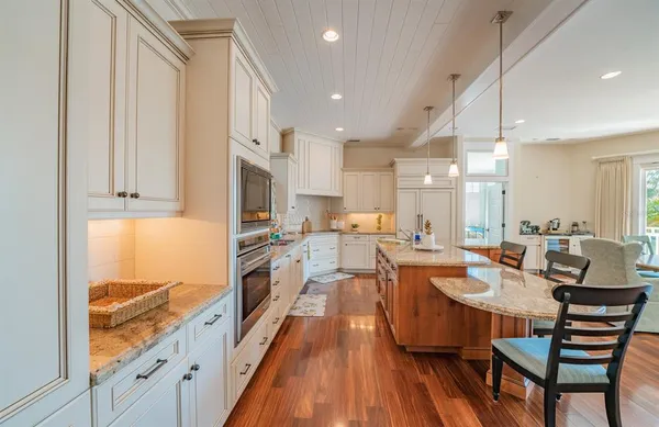 a kitchen with stainless steel appliances granite countertop a stove and refrigerator