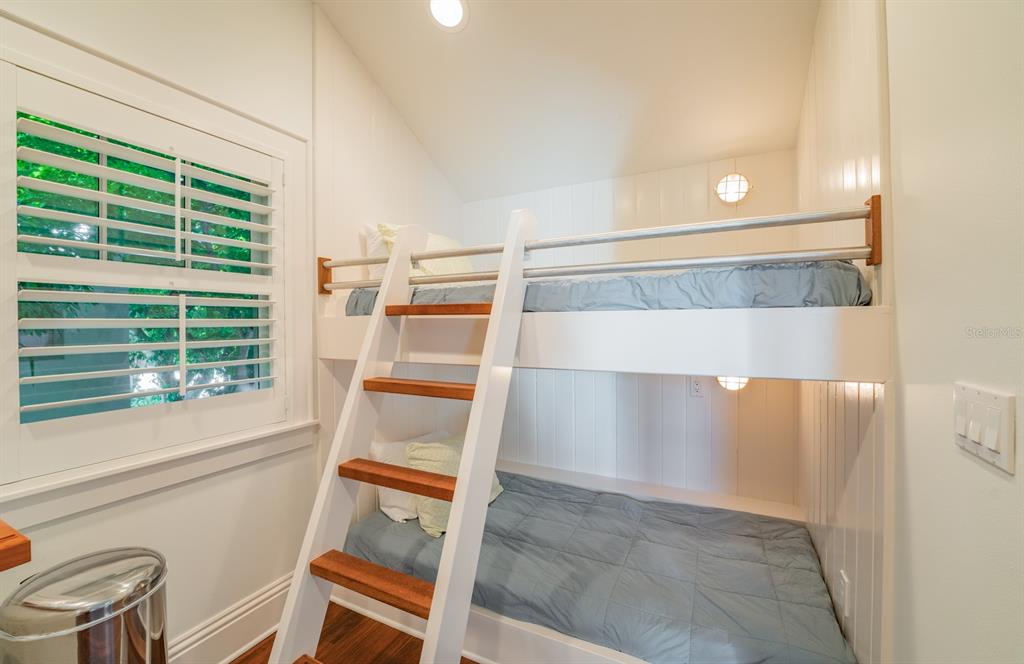 714 Jacaranda Road Anna Maria, FL 34216 - Photo 65 of 100 a view of wooden floor and windows in a room