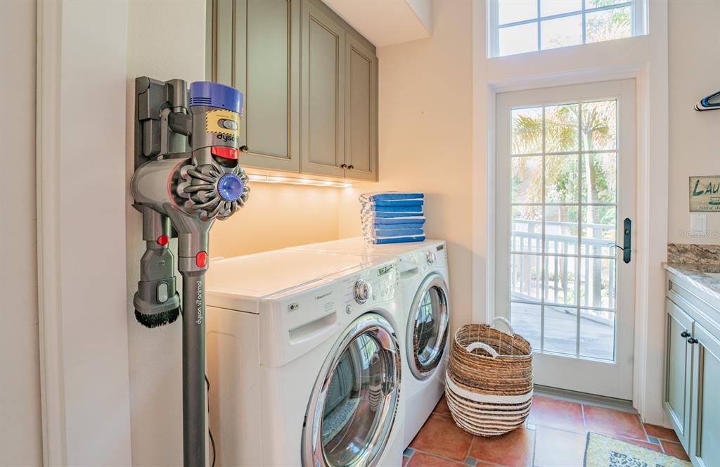 714 Jacaranda Road Anna Maria, FL 34216 - Photo 71 of 100 a utility room with dryer and washer