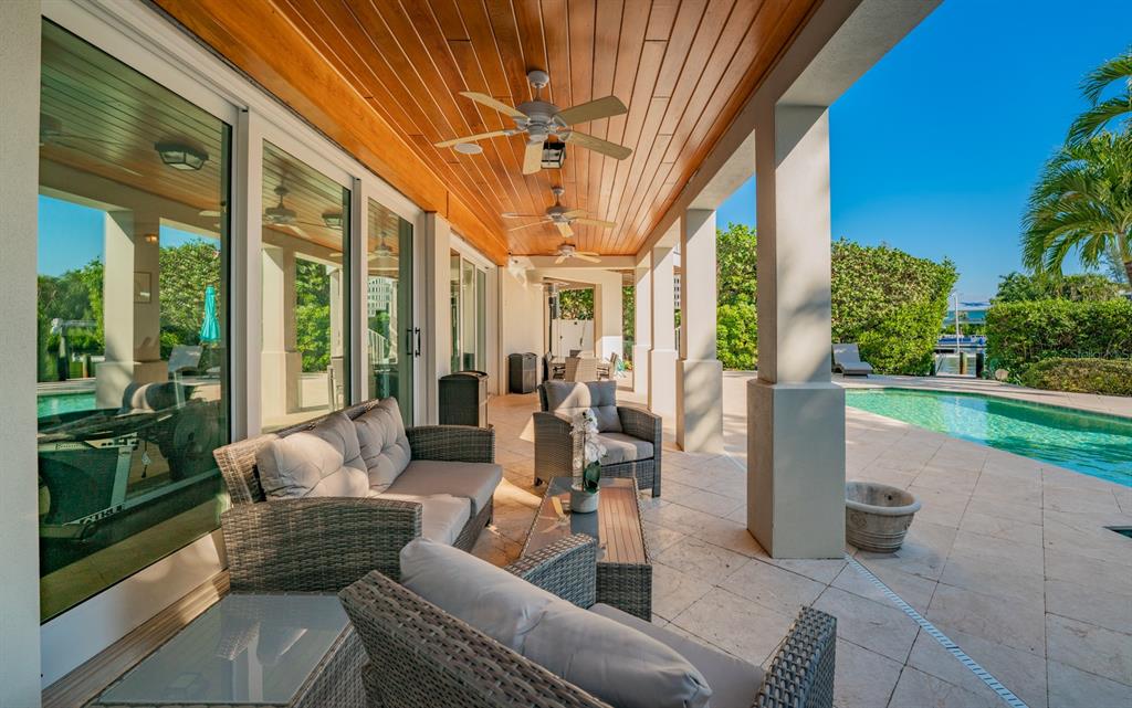 714 Jacaranda Road Anna Maria, FL 34216 - Photo 83 of 100 a outdoor space with patio the couches and a dining table with garden view