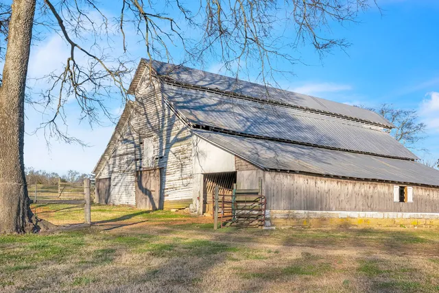 a view of a swimming pool with an outdoor space and seating area