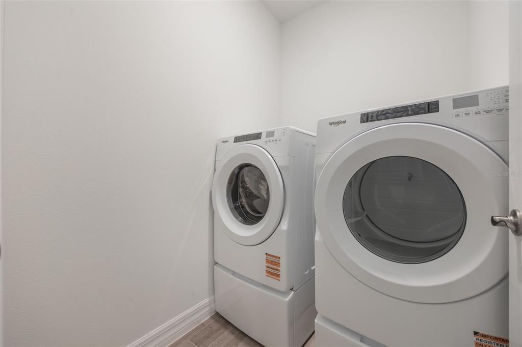 2277 Hamden Way Mount Dora, FL 32757 - Photo 11 of 32 a utility room with dryer and washer