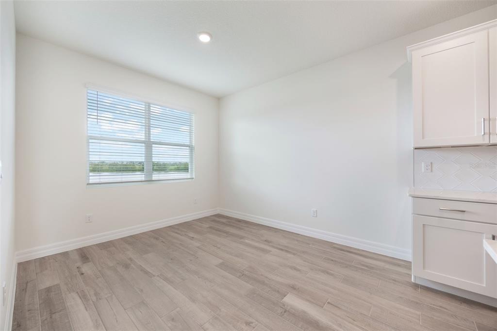 2277 Hamden Way Mount Dora, FL 32757 - Photo 17 of 32 an empty room with windows and closet
