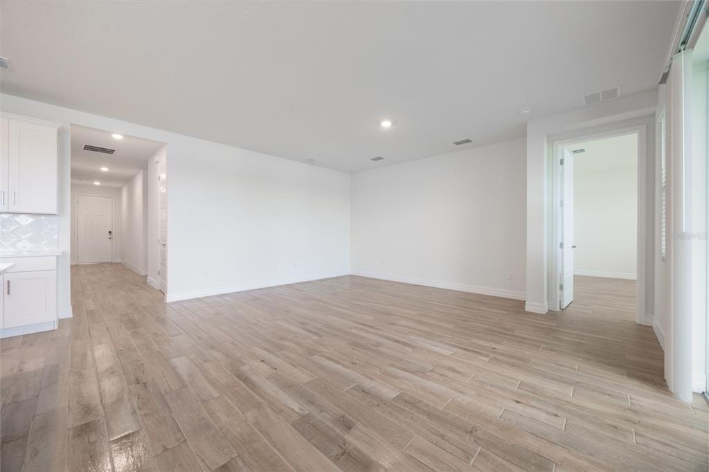 2277 Hamden Way Mount Dora, FL 32757 - Photo 21 of 32 a view of empty room with wooden floor