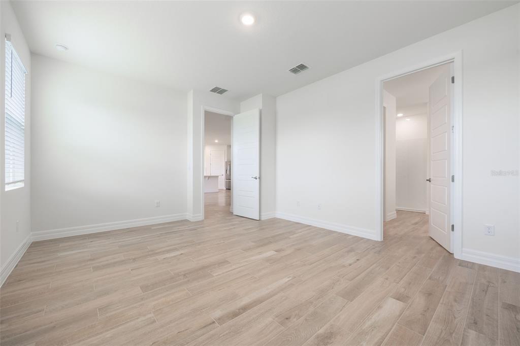 2277 Hamden Way Mount Dora, FL 32757 - Photo 24 of 32 wooden floor in an empty room