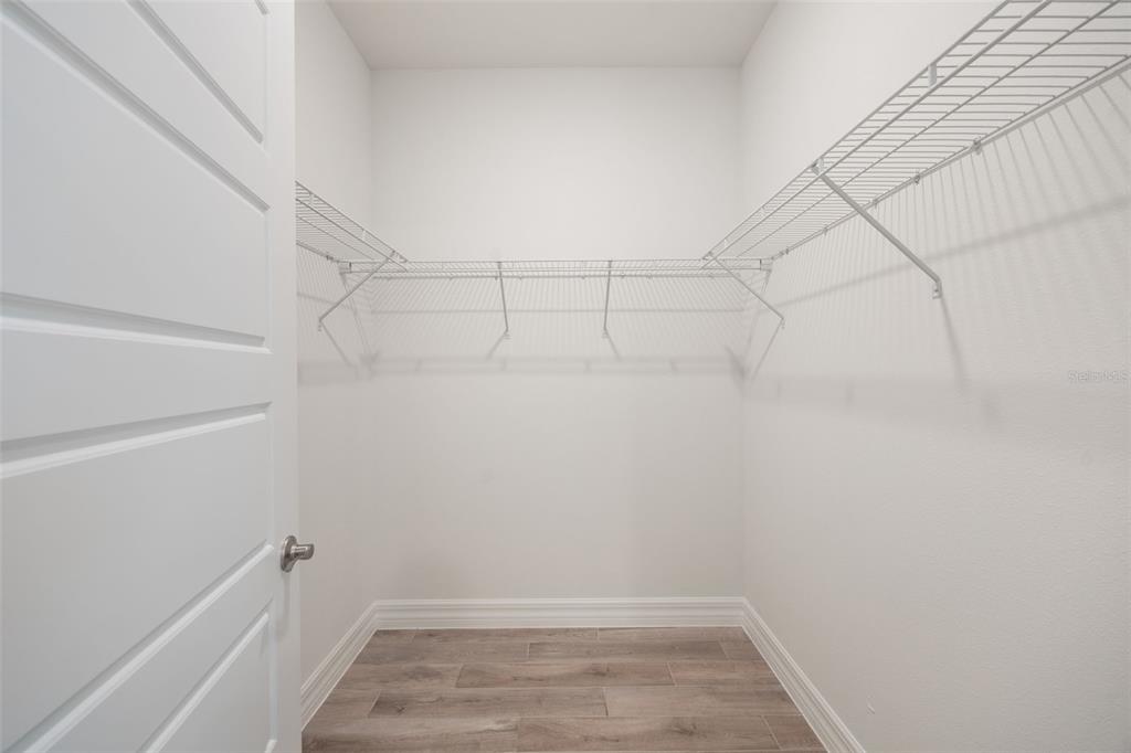 2277 Hamden Way Mount Dora, FL 32757 - Photo 30 of 32 a view of a room with racks on the wall