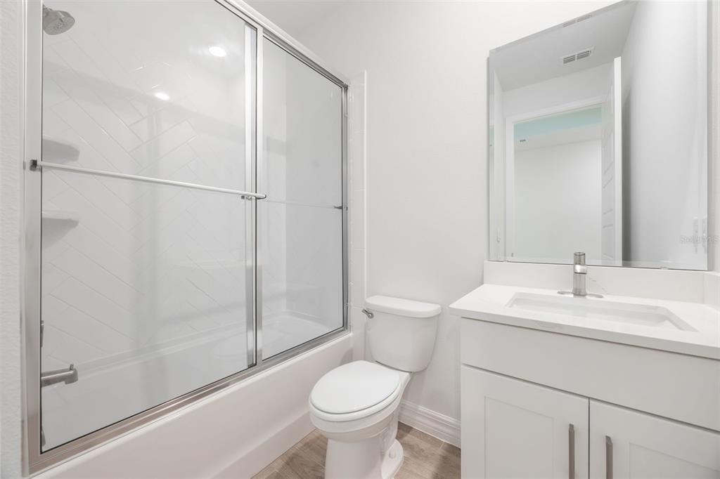 2277 Hamden Way Mount Dora, FL 32757 - Photo 4 of 32 a bathroom with a sink toilet and shower
