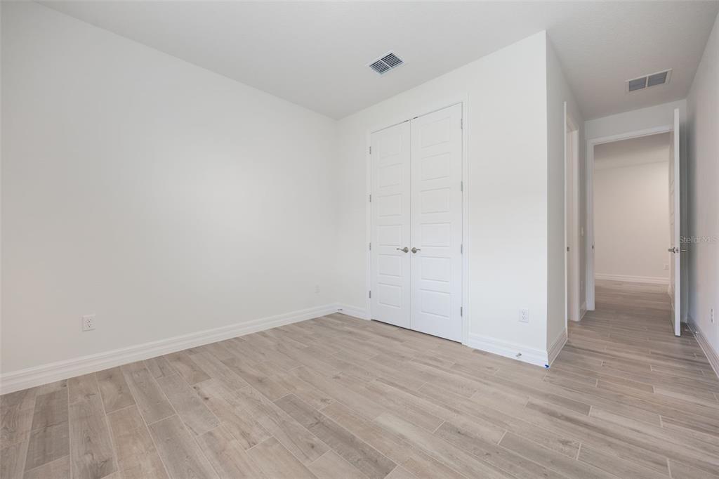 2277 Hamden Way Mount Dora, FL 32757 - Photo 10 of 32 a view of room with wooden floor