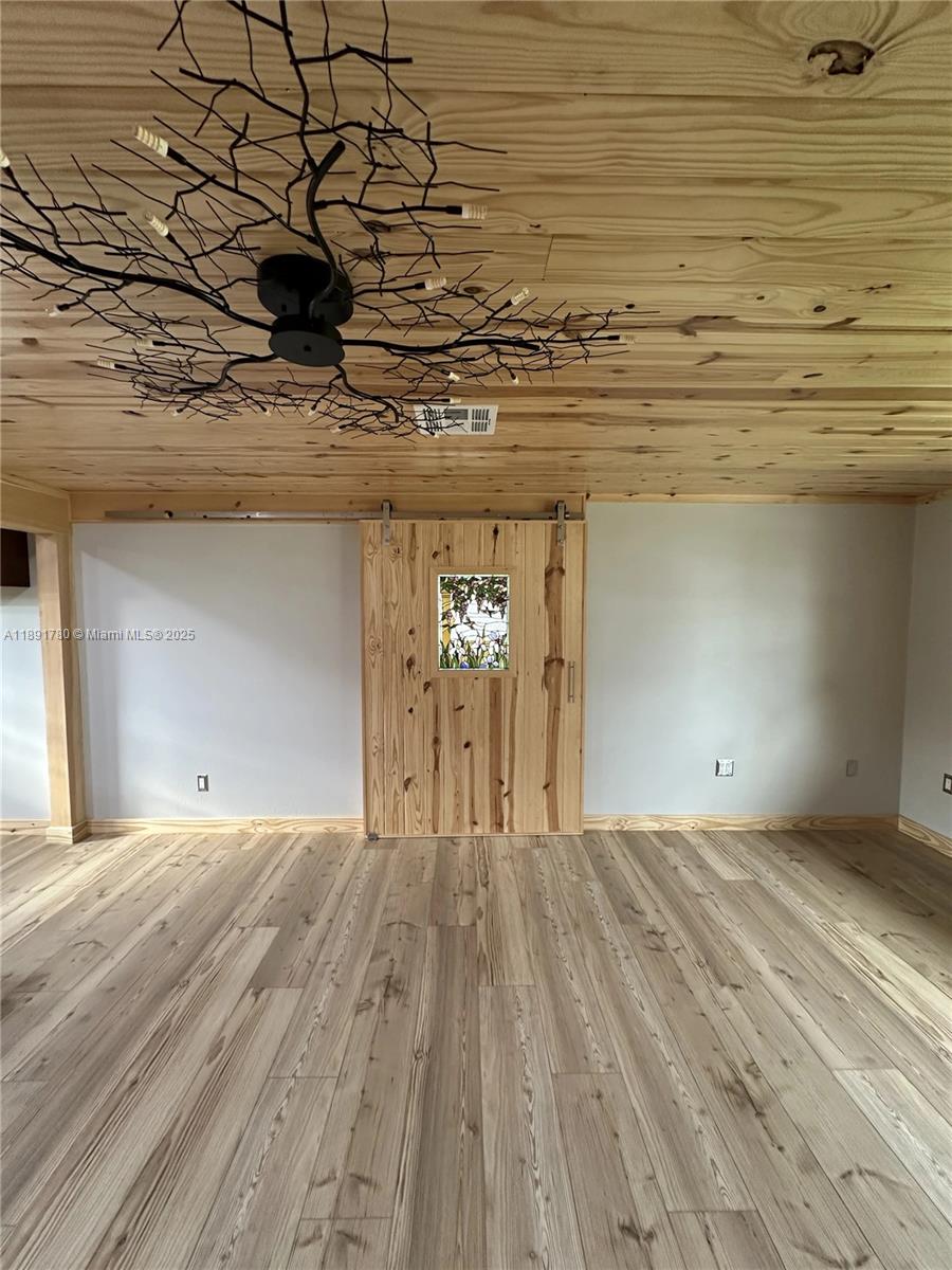 111 Springdale Road Sebring, FL 33870 - Photo 11 of 50 a view of a room with a wooden floor