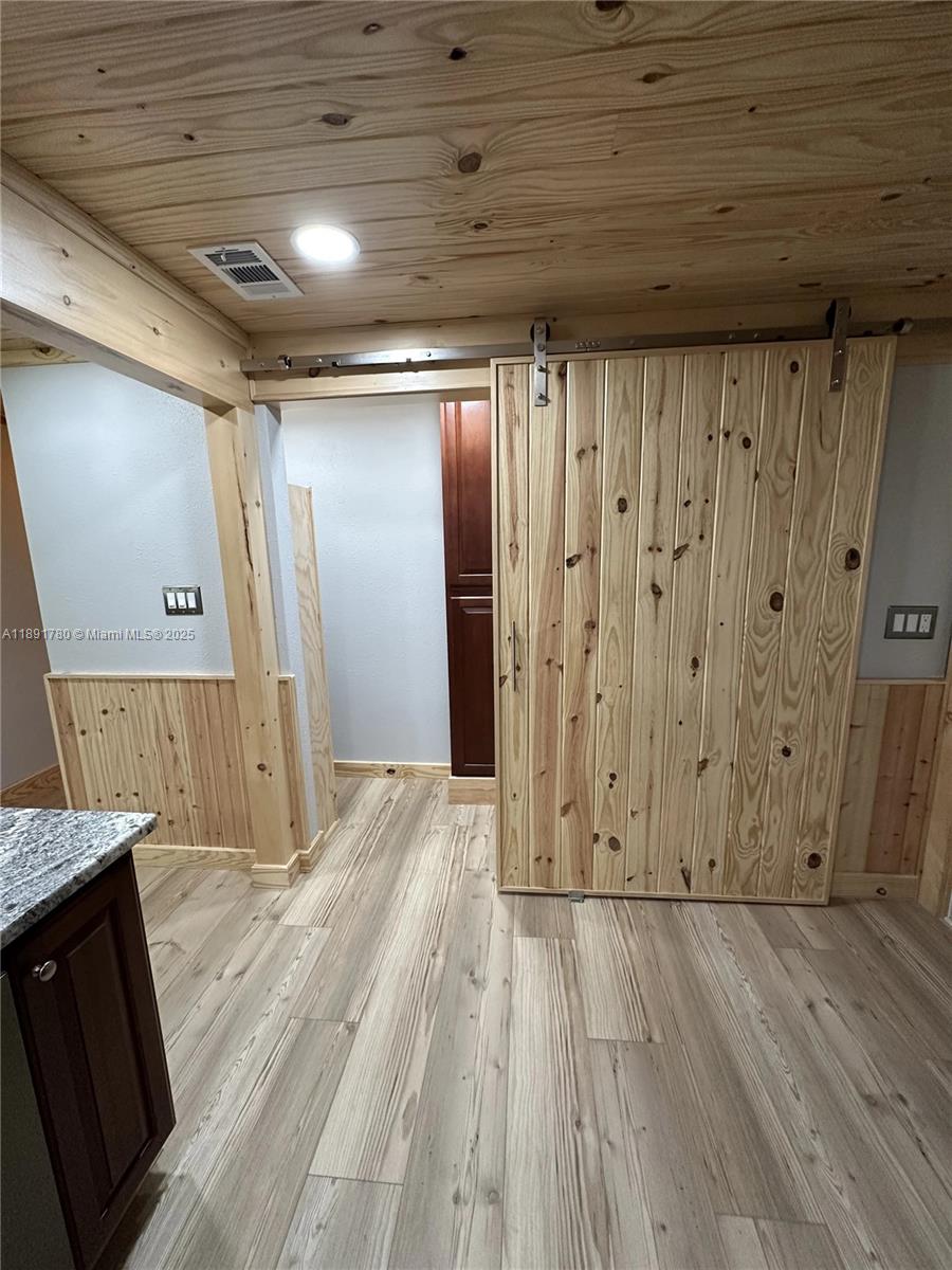 111 Springdale Road Sebring, FL 33870 - Photo 12 of 50 a view of hallway with wooden floor