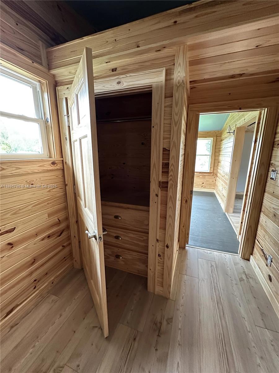 111 Springdale Road Sebring, FL 33870 - Photo 16 of 50 a view of a hallway with wooden floor and staircase
