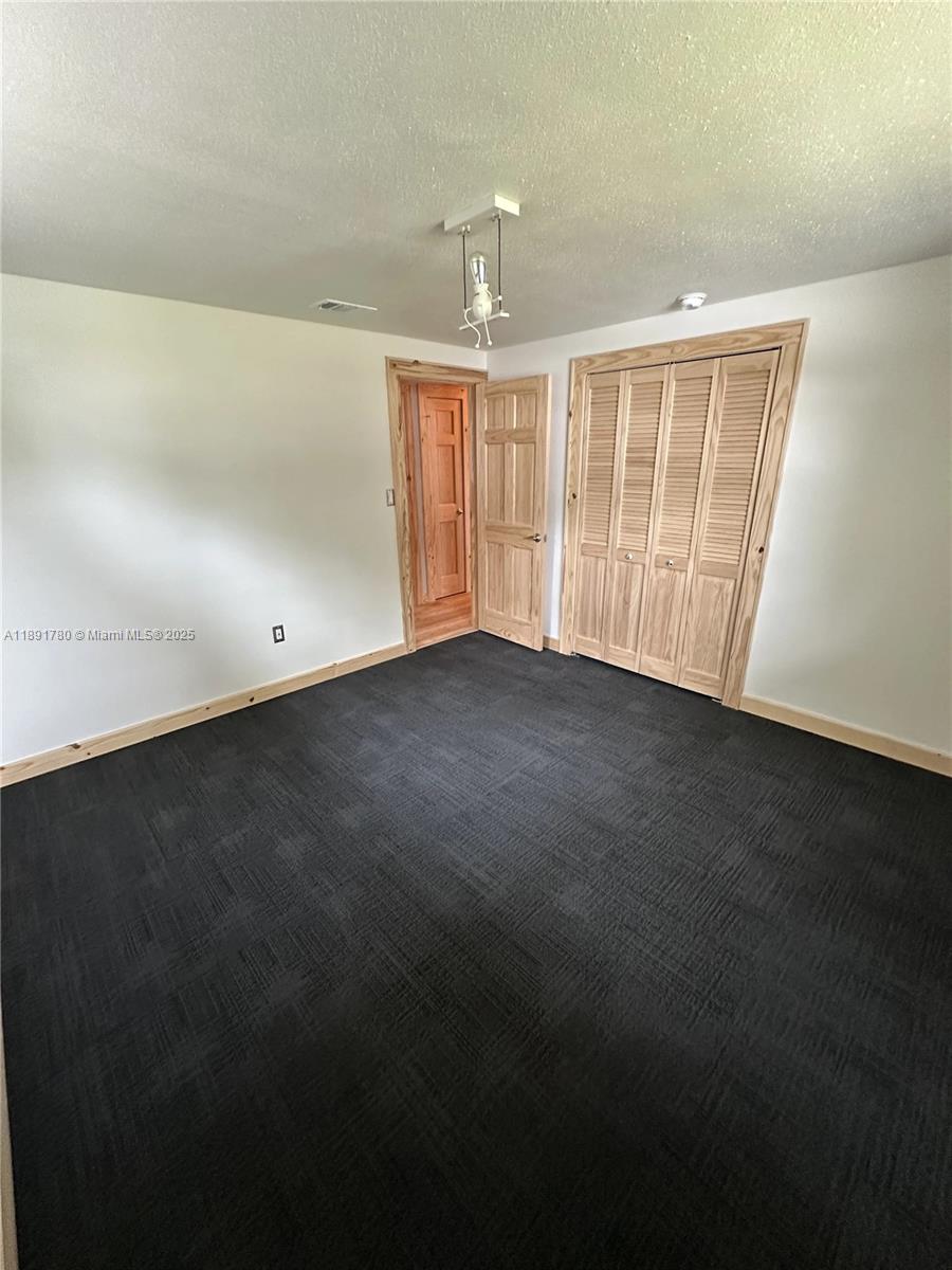 111 Springdale Road Sebring, FL 33870 - Photo 18 of 50 an empty room with windows