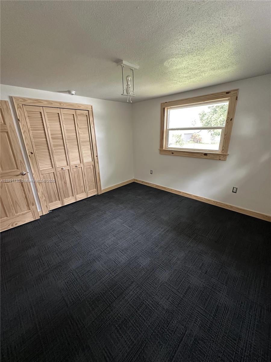 111 Springdale Road Sebring, FL 33870 - Photo 19 of 50 a view of an empty room with a window
