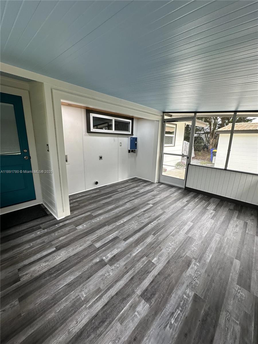 111 Springdale Road Sebring, FL 33870 - Photo 2 of 50 a view of empty room with wooden floor