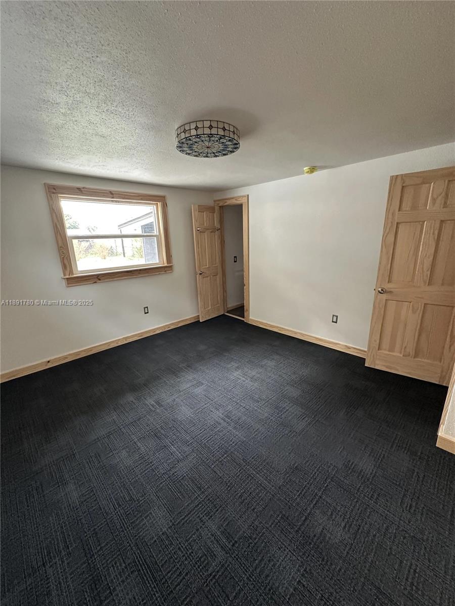 111 Springdale Road Sebring, FL 33870 - Photo 21 of 50 a view of an empty room with a window