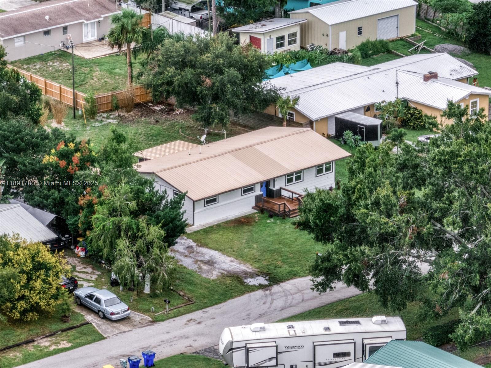 111 Springdale Road Sebring, FL 33870 - Photo 49 of 50 an aerial view of a house with a yard and lake view