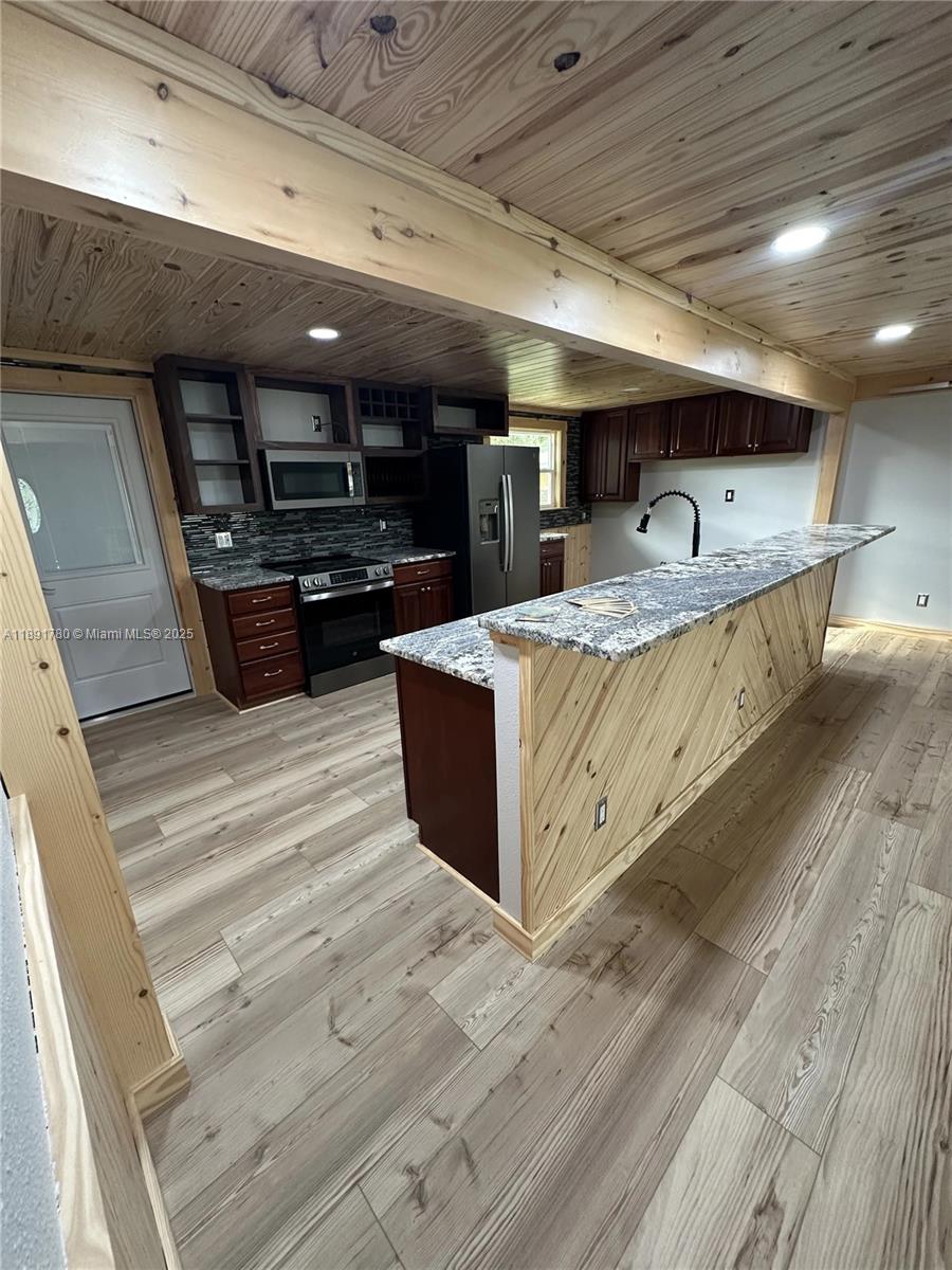 111 Springdale Road Sebring, FL 33870 - Photo 7 of 50 a large room with lots of wooden furniture