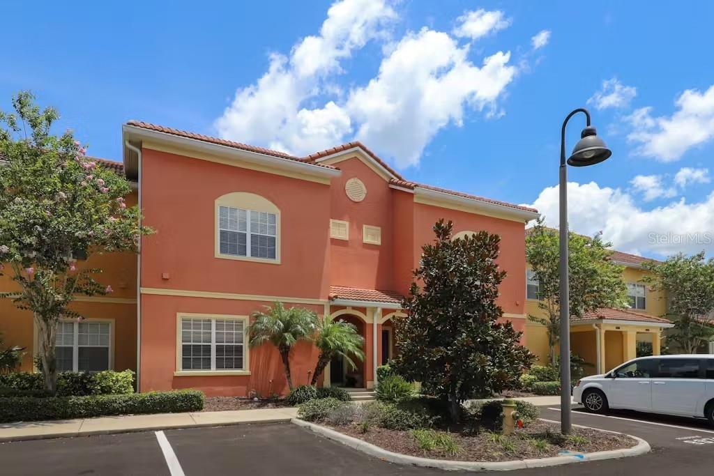 8975 Candy Palm Road Kissimmee, FL 34747 - Photo 1 of 1 a front view of a house with garden