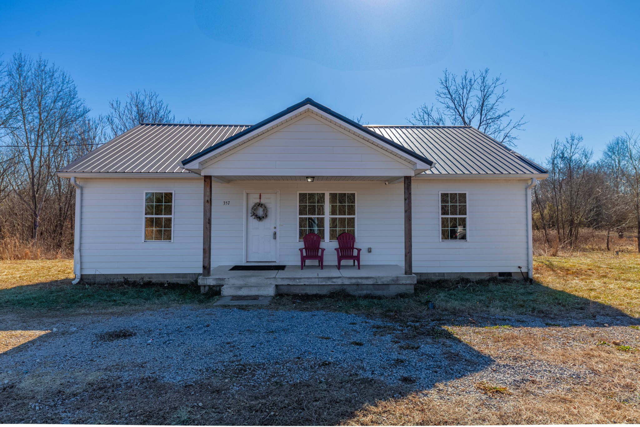 357 Munro Road Pulaski, TN 38478 - Photo 27 of 37 a front view of a house with a yard