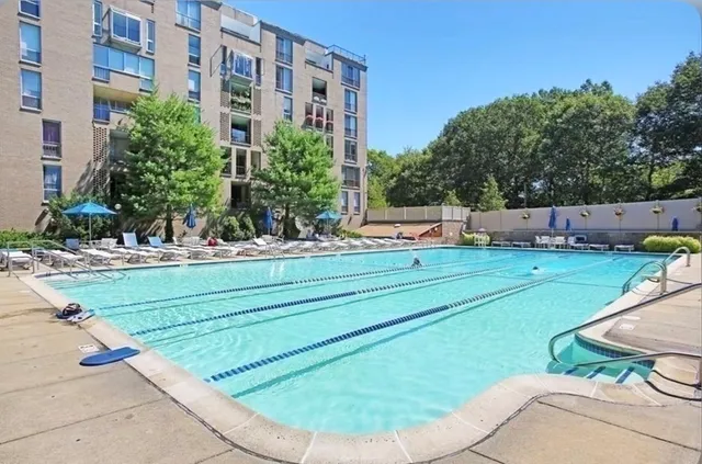 a view of a chairs and tables in the backyard