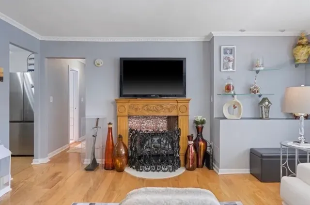 a living room with furniture and a fireplace